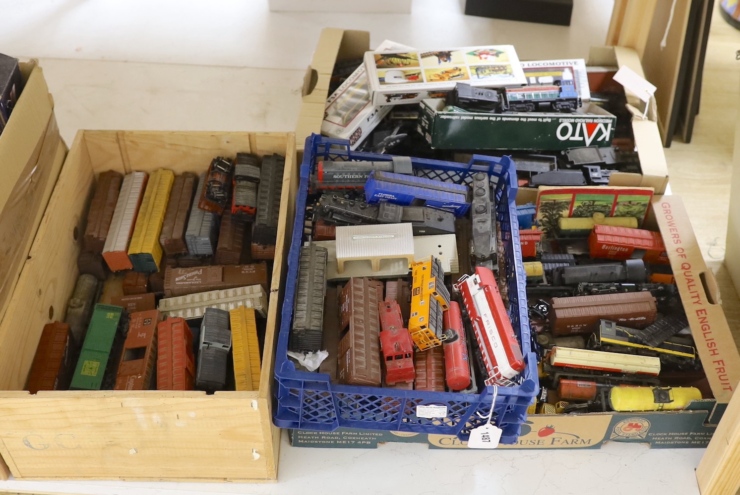 A large collection of 00 gauge toy locomotives and rolling stock